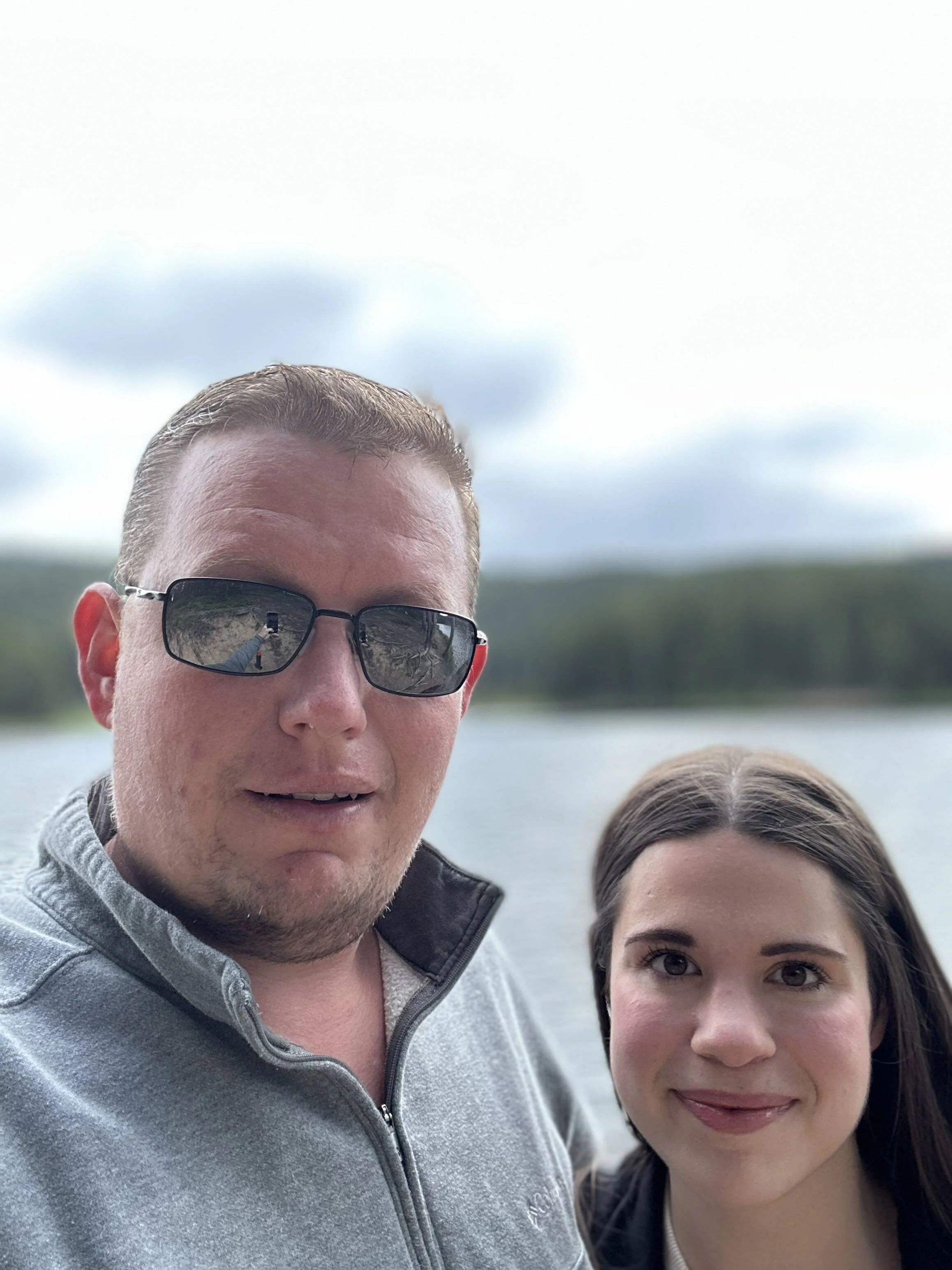 Tyler and Gianna, owners of Amazing RV Solutions, by the lake